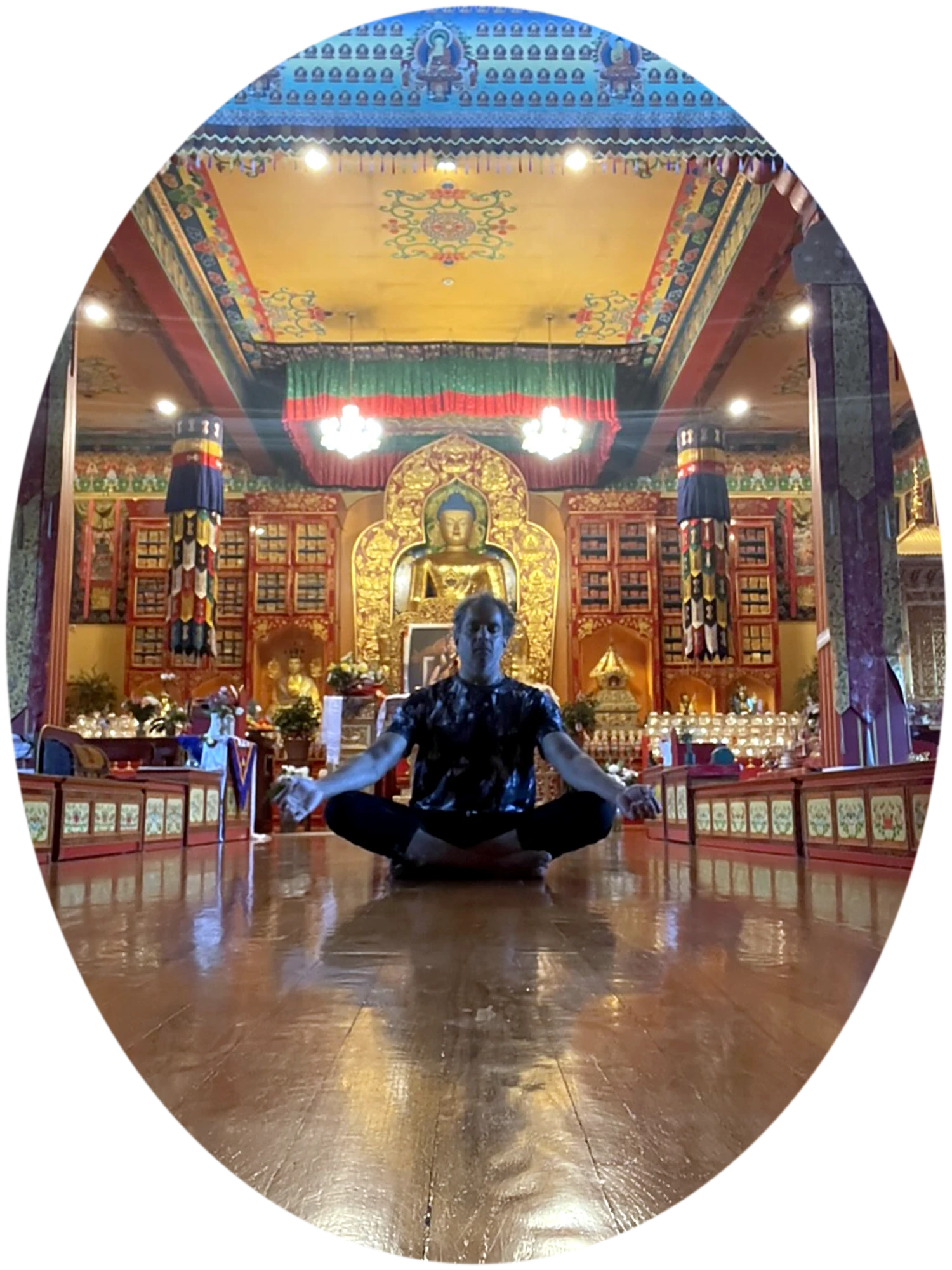 Sachin Barot meditating in a Tibetan Buddhist temple